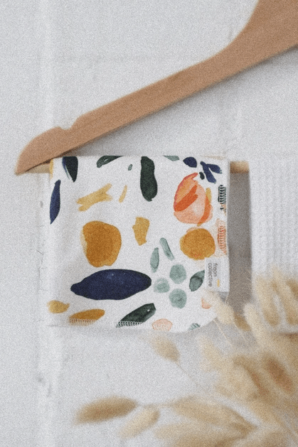 Face cloth showcased in hanger, in Sierra Florals, a colourful floral print